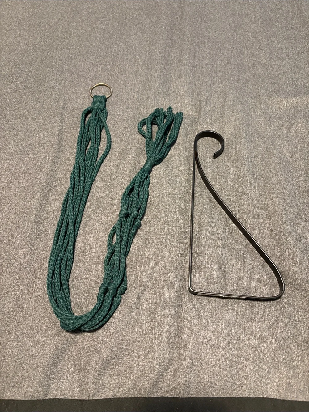 Vintage Boho Green Macrame Plant Hanger and black metal wall plant hanger.